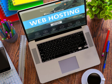 laptop with web hosting banner to discuss does web hosting affect seo performance