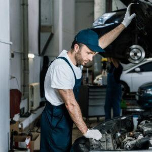 Mechanic checking car