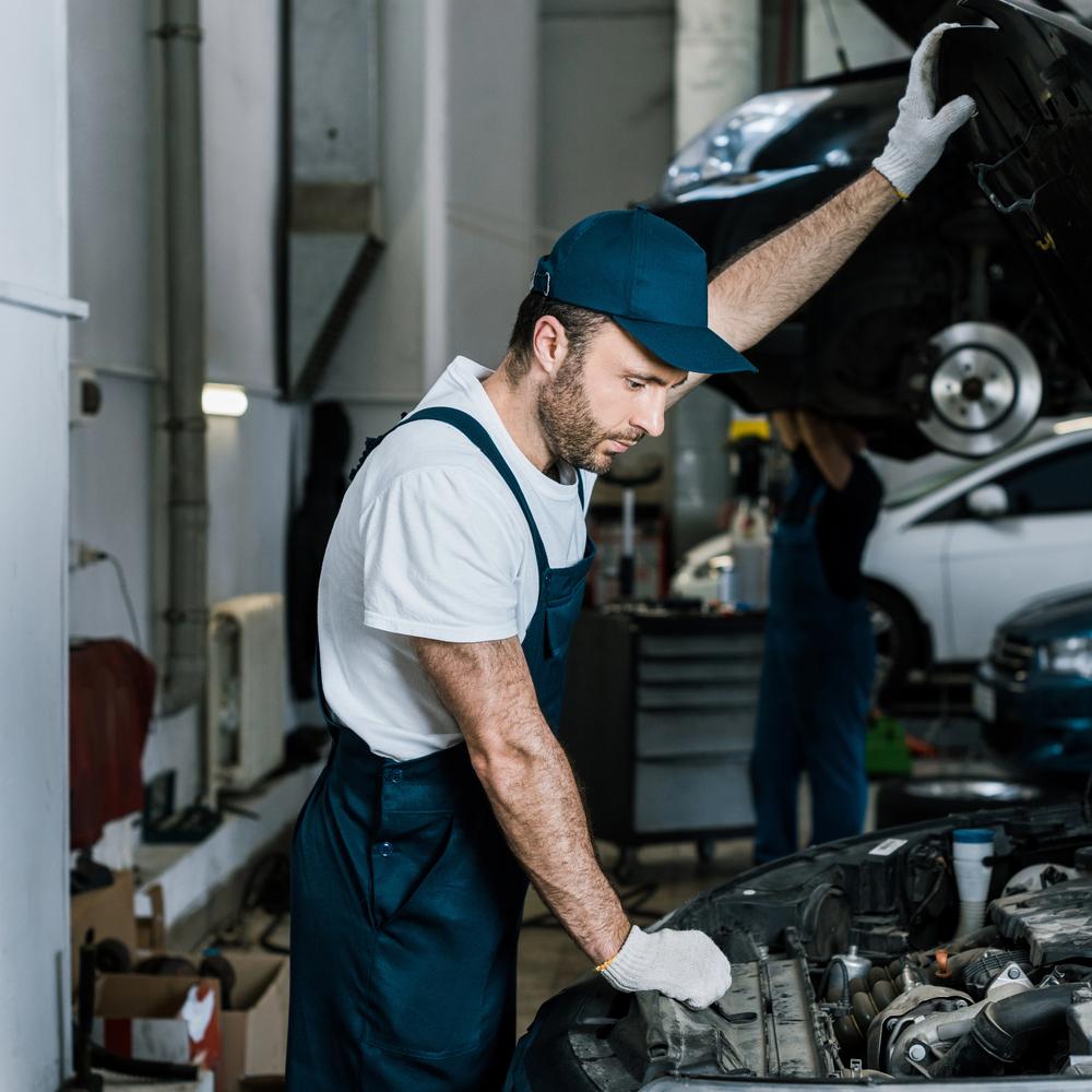 Mechanic checking car