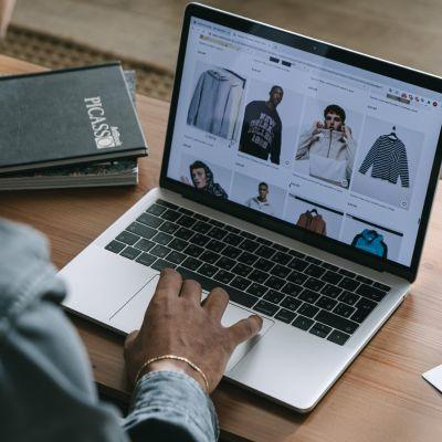 Man looking at ecommerce site on laptop