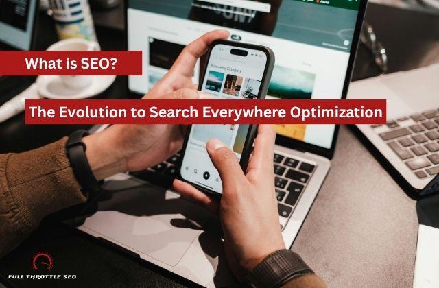 hands holding cell phone browsing categories with a leptop in the background. There's title text overlay saying "What is SEO? The Evolution to Search Everywhere Optimization" in white letters with red background